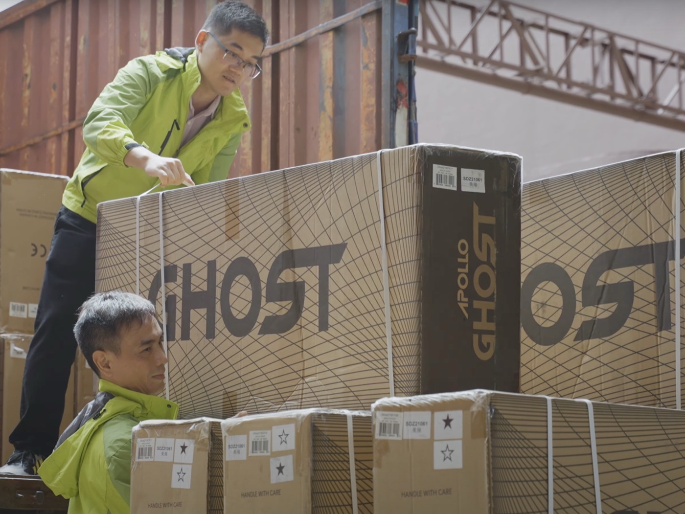 MorePlus team loading packed goods into a shipping container